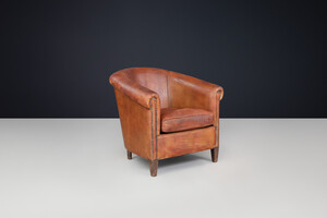 Antique Art deco Patinated scheepskin leather Lounge Chair, France 1940 Early-20th century