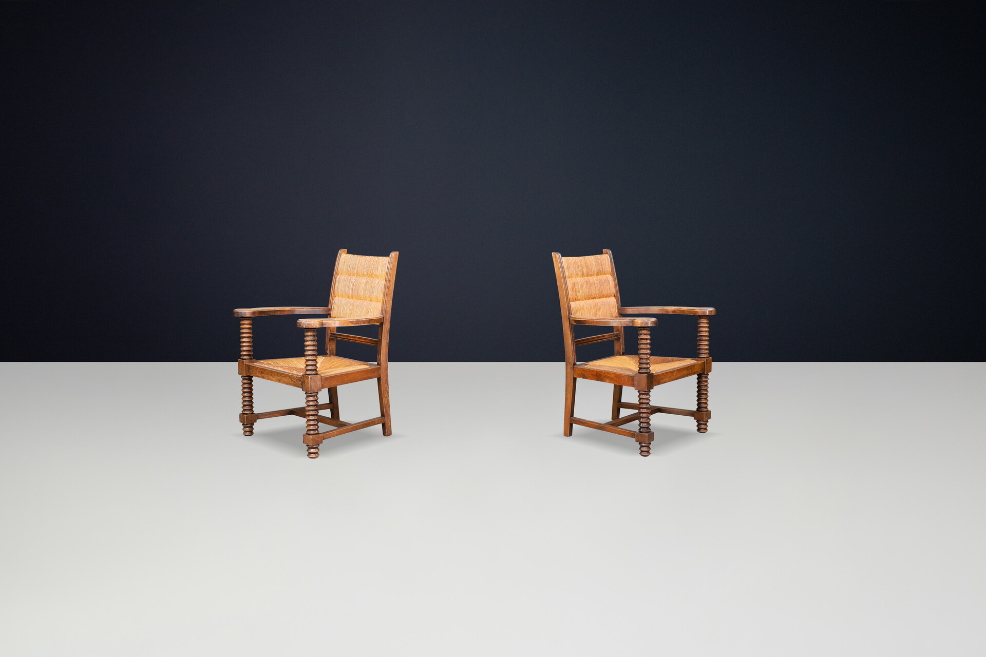 Charles Dudouyt Patinated Oak and Rush Armchairs, France 1940s Mid-20th century