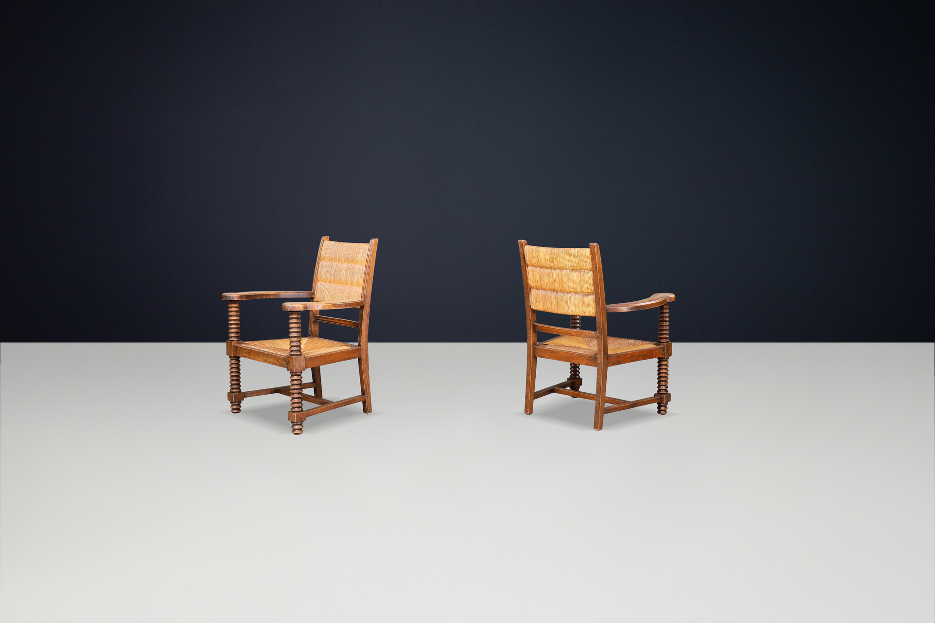 Charles Dudouyt Patinated Oak and Rush Armchairs, France 1940s Mid-20th century