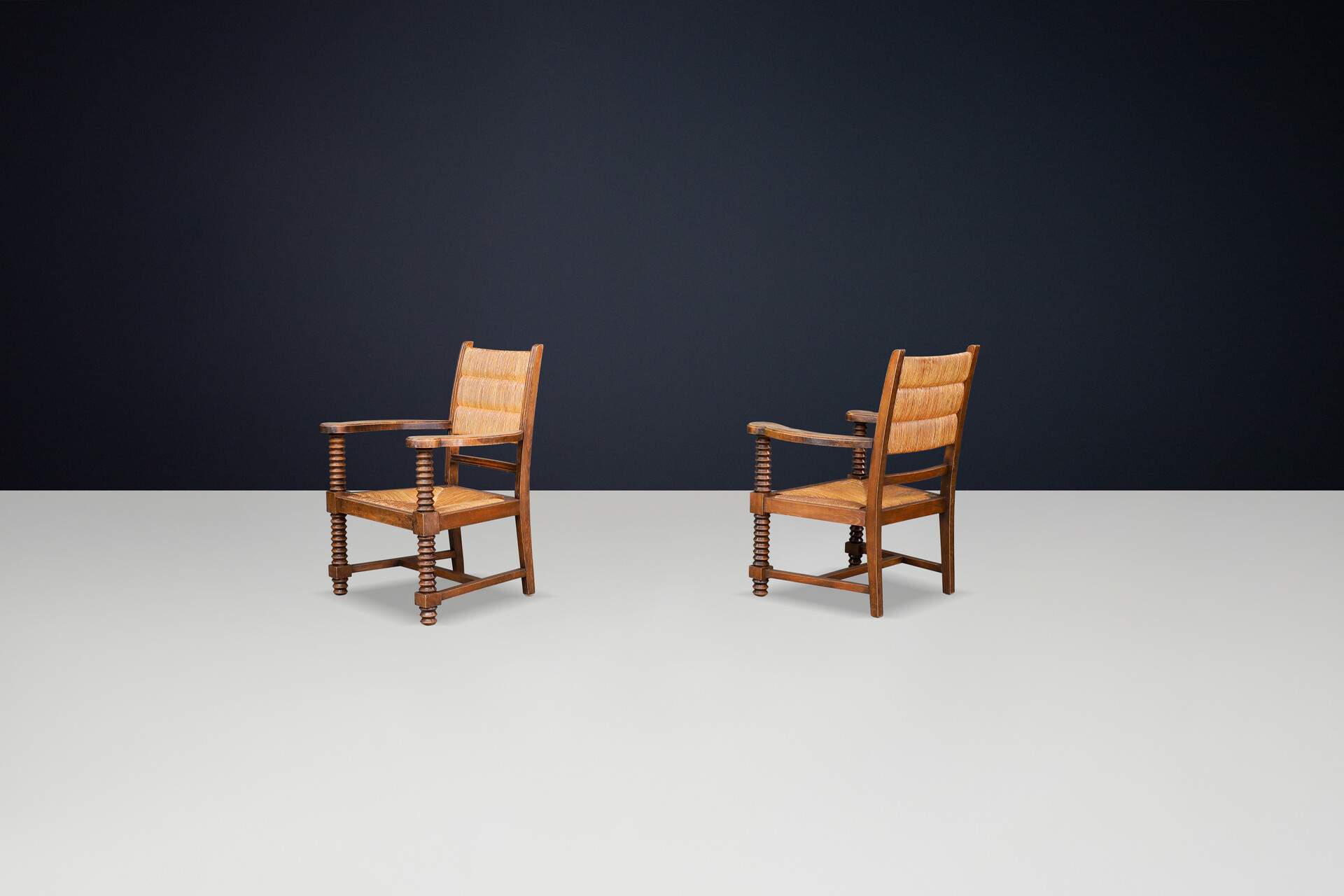 Charles Dudouyt Patinated Oak and Rush Armchairs, France 1940s Mid-20th century