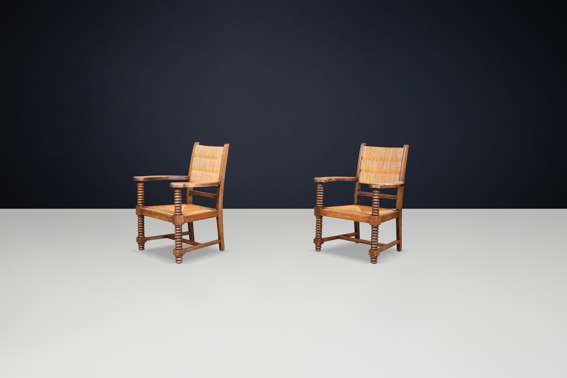 Charles Dudouyt Patinated Oak and Rush Armchairs, France 1940s Mid-20th century