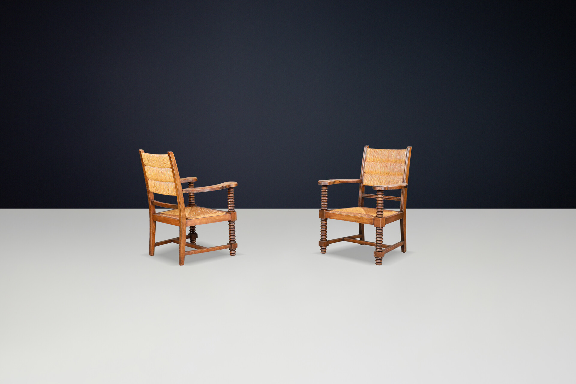 Charles Dudouyt Patinated Oak and Rush Armchairs, France 1940s Mid-20th century