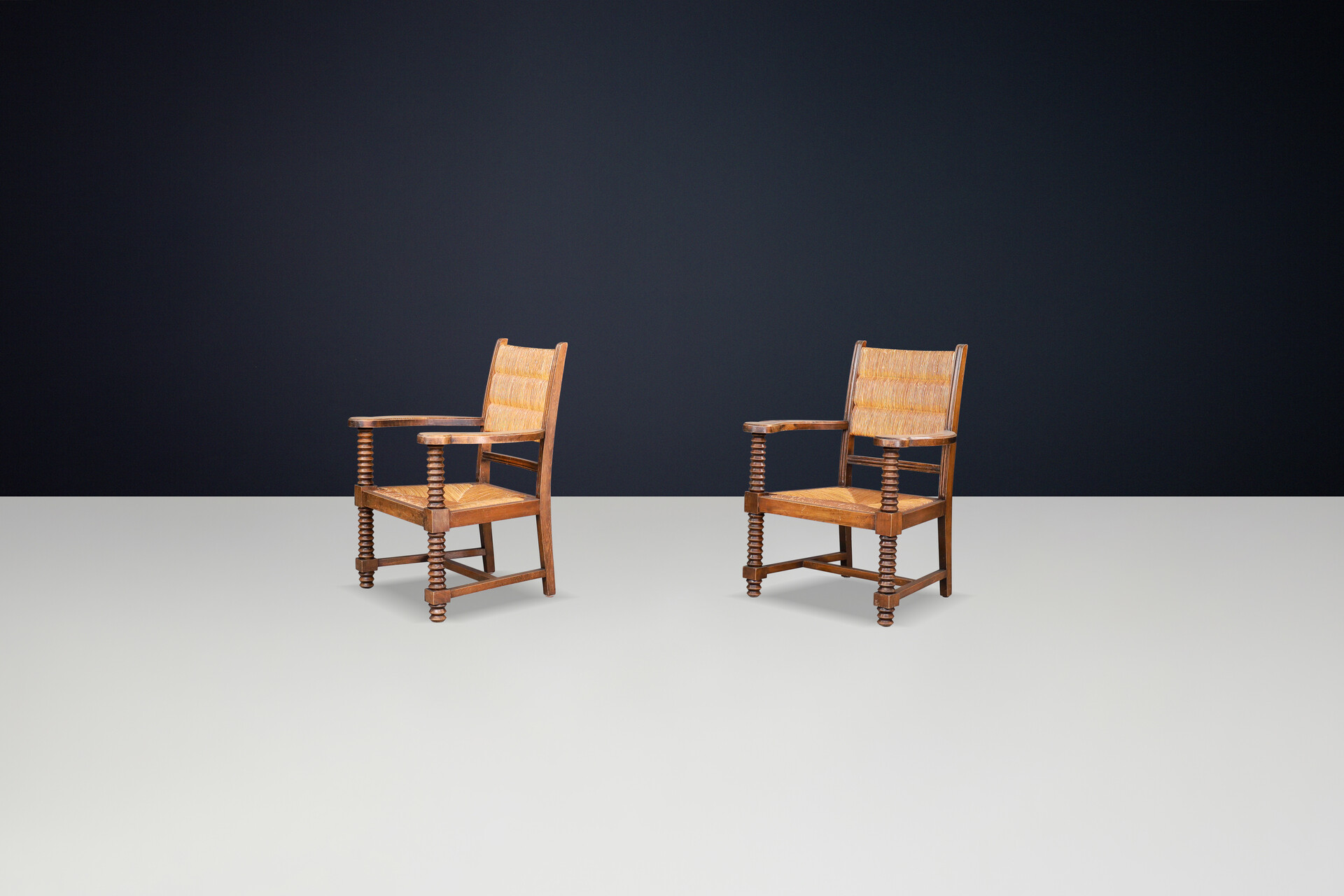 Charles Dudouyt Patinated Oak and Rush Armchairs, France 1940s Mid-20th century