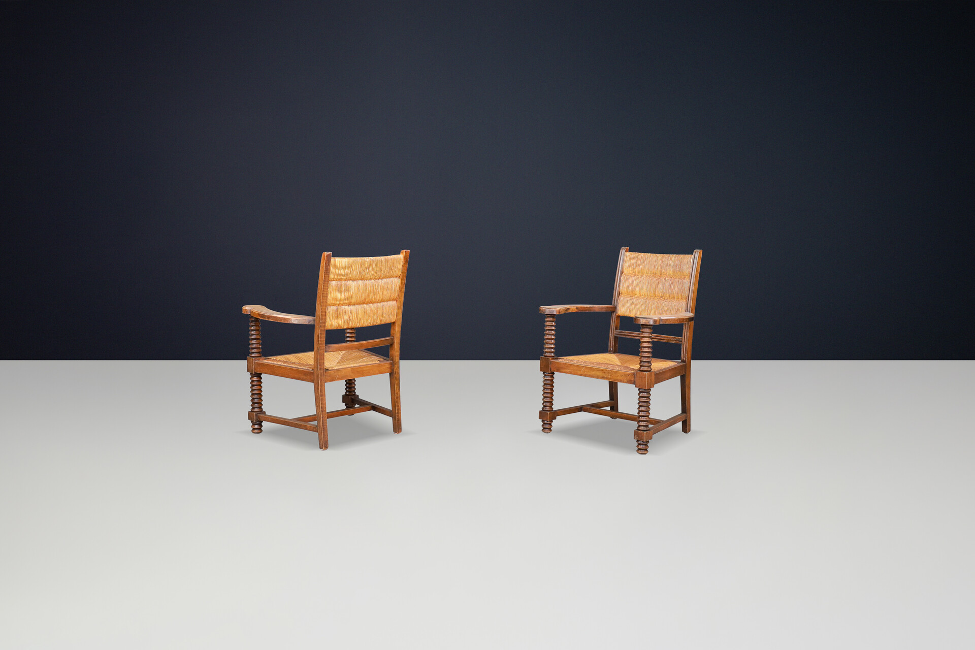 Charles Dudouyt Patinated Oak and Rush Armchairs, France 1940s Mid-20th century