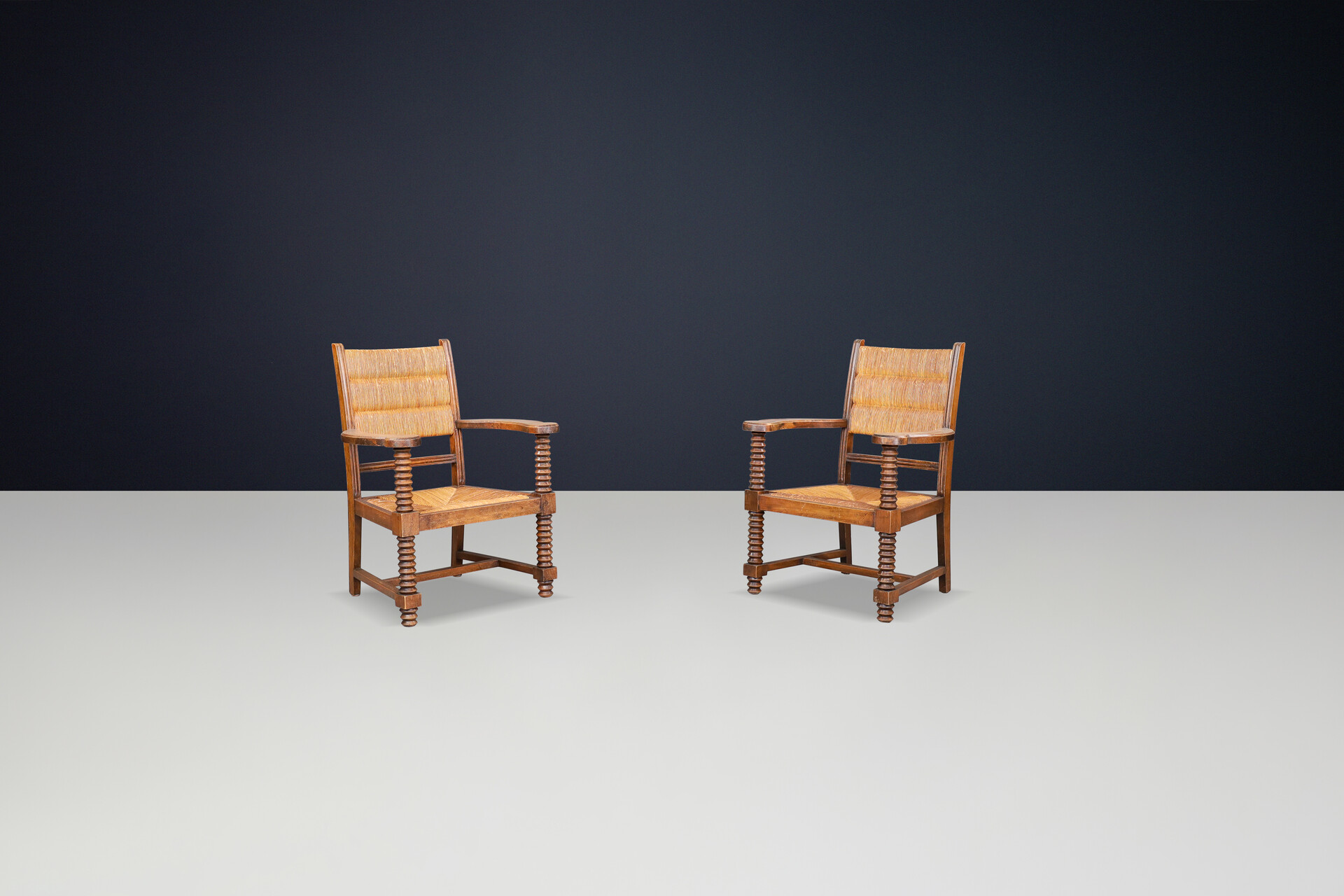 Charles Dudouyt Patinated Oak and Rush Armchairs, France 1940s Mid-20th century