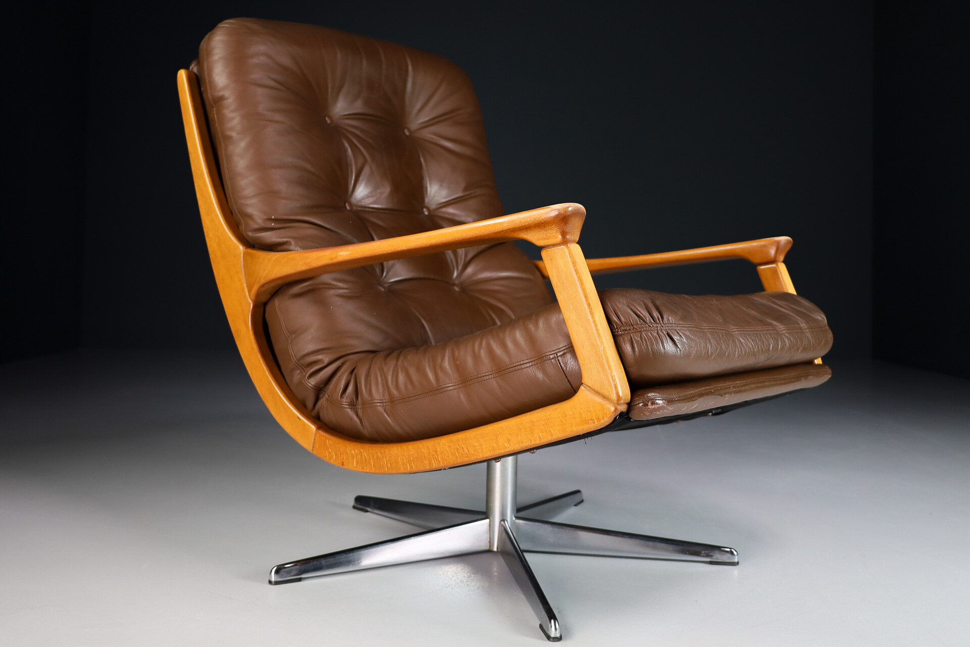 Mid century modern Leather and wood Swivel lounge chair with