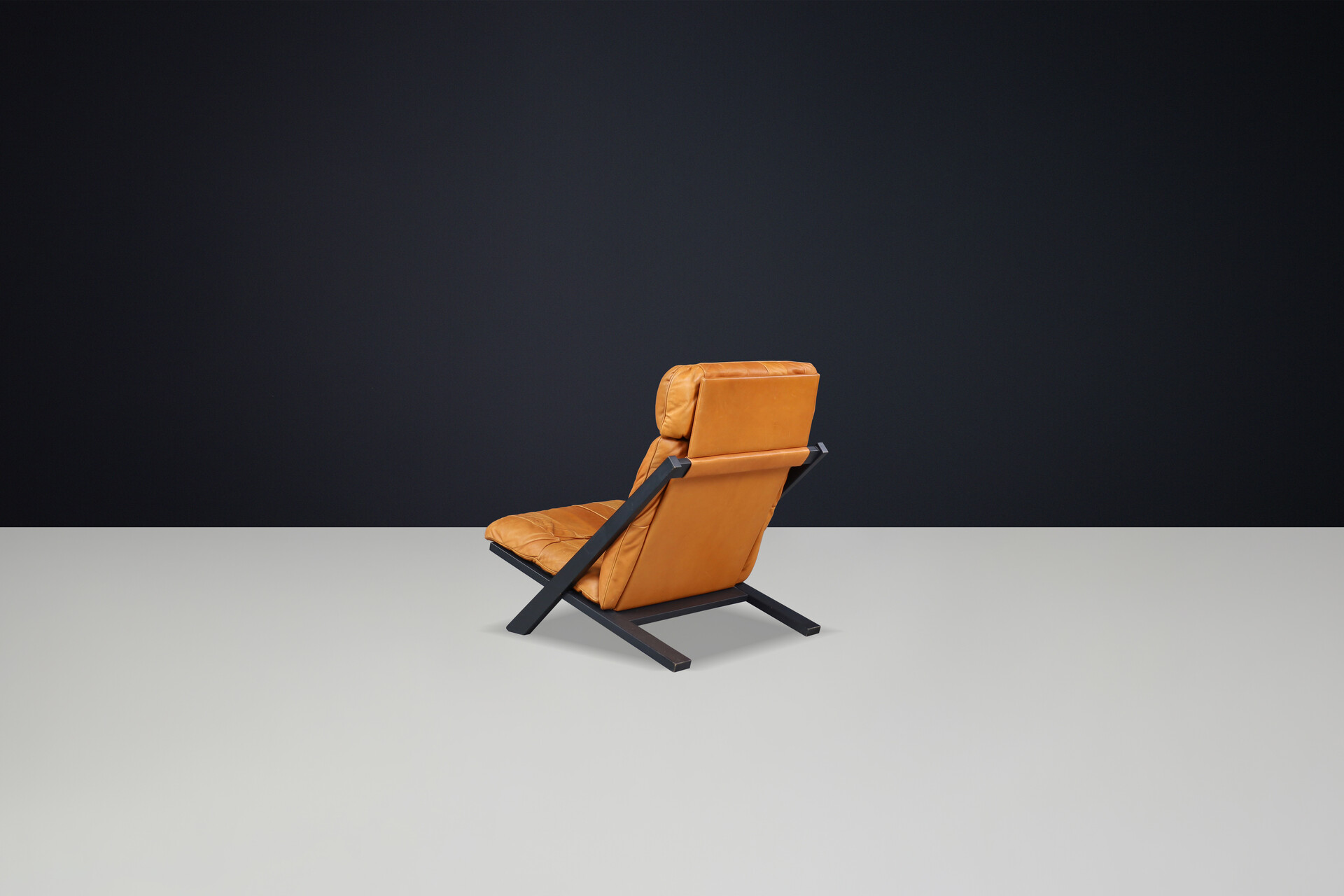 Mid century modern Ueli Berger for De Sede, lounge chair, wood, Cognac leather, Switzerland, 1970s. Late-20th century